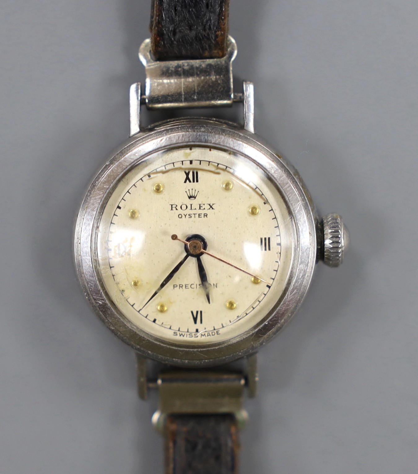 A lady's 1940's stainless steel Rolex Oyster Precision manual wind wrist watch, on associated strap, case diameter 24mm.